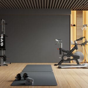 A gym with a mat and exercise equipment.