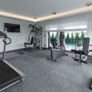 A gym with many different equipment in it