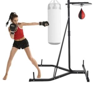 Woman boxing with freestanding heavy bag.