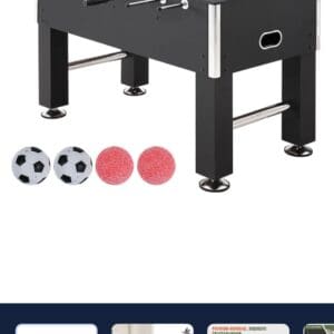 Black foosball table with balls.