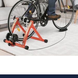 Red bike trainer stand in use.