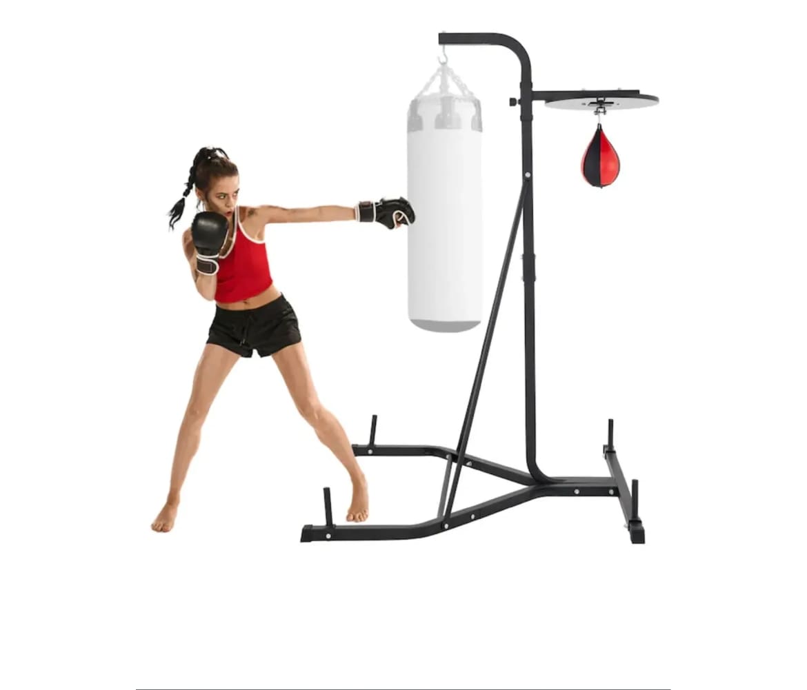Woman boxing with punching bag stand.